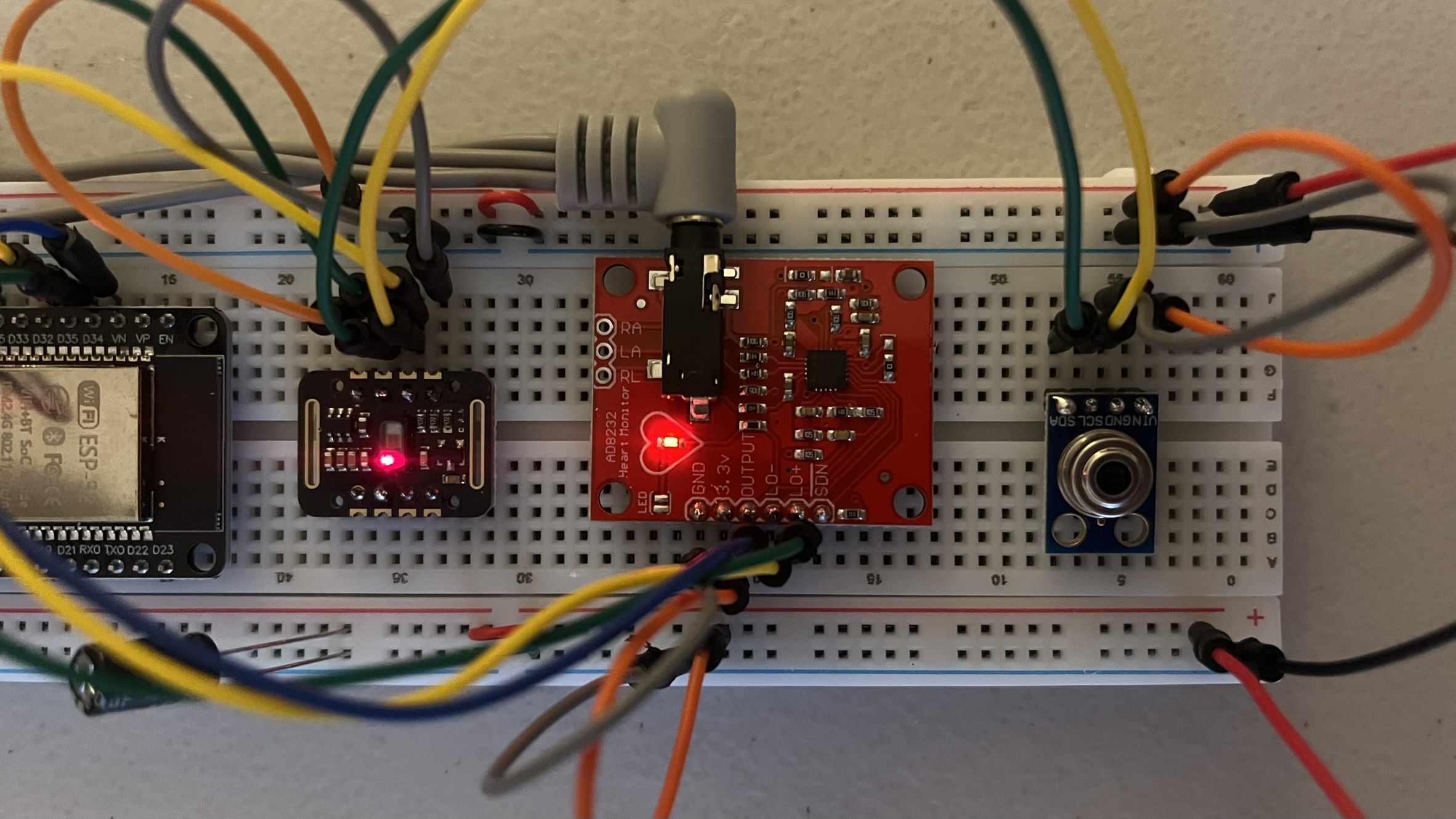 Wiring close-up: MAX30102, AD8232 (heart LED lit) and MLX90614